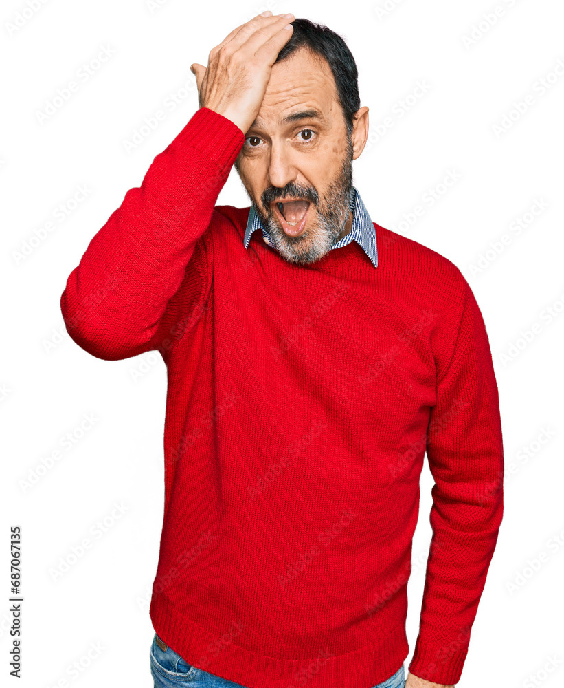 Middle age hispanic man wearing casual clothes surprised with hand on head for mistake, remember error. forgot, bad memory concept. Middle age hispanic man wearing casual clothes surprised with hand on head for mistake, remember error. forgot, bad memory concept.
