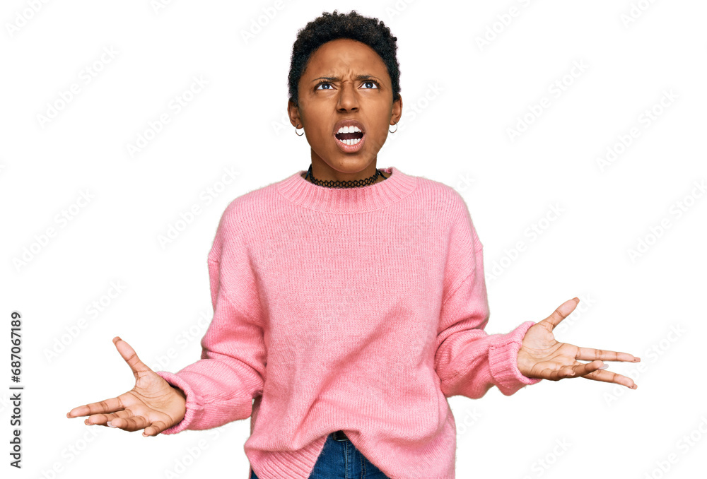 Φωτογραφία Young african american woman wearing casual clothes crazy and mad shouting and yelling with aggressive expression and arms raised