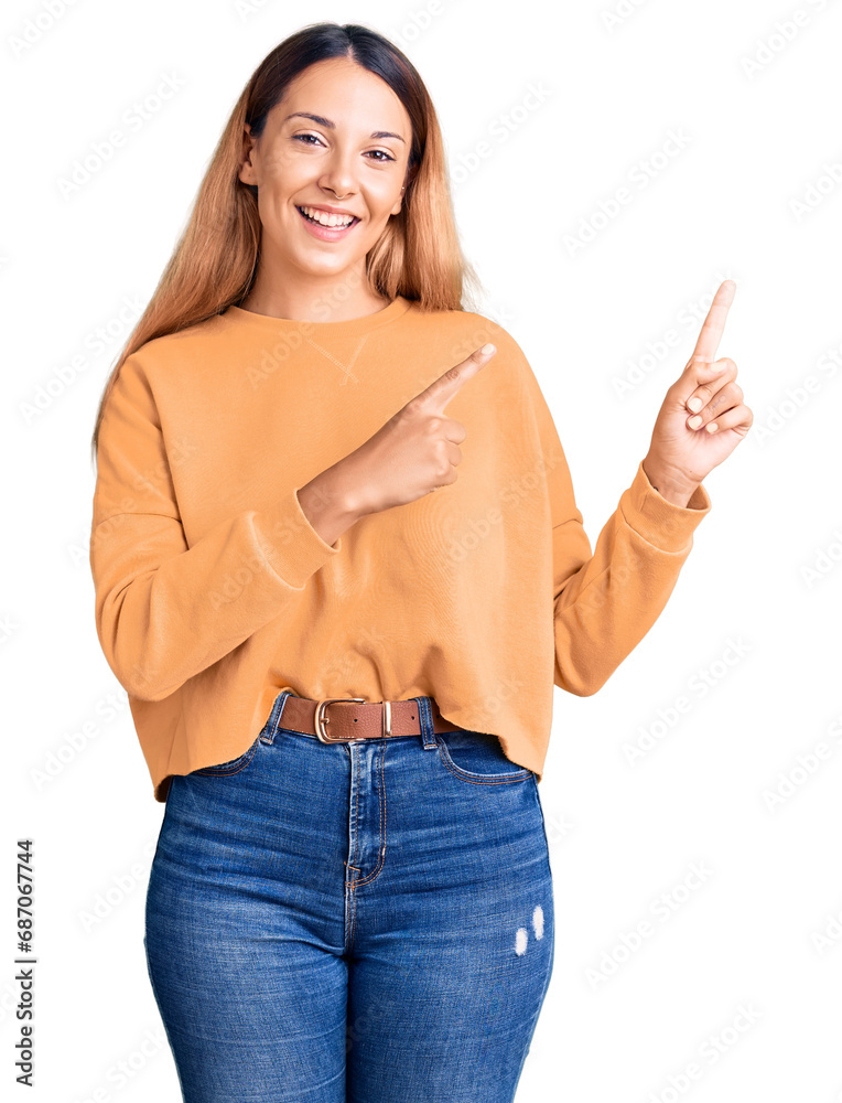 Φωτογραφία Beautiful young woman wearing casual clothes smiling and looking at the camera pointing with two hands and fingers to the side