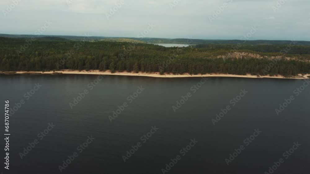 Russia, Lake Ladoga, Koyonsaari. View of the coast of the island in a cold lake. Beautiful nature of the Republic of Karelia. Panoramic view from the height of the Ladoga skerry islands. 4K Russia, Lake Ladoga, Koyonsaari. View of the coast of the island in a cold lake. Beautiful nature of the Republic of Karelia. Panoramic view from the height of the Ladoga skerry islands. 4K