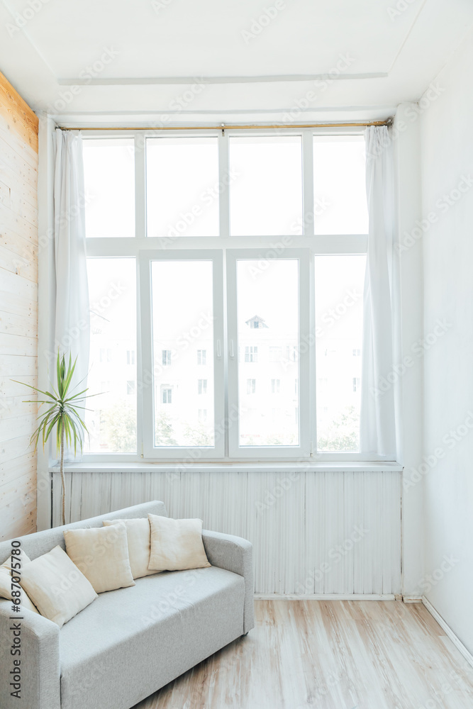 Fototapeta premium Interior of a white empty room with a large window