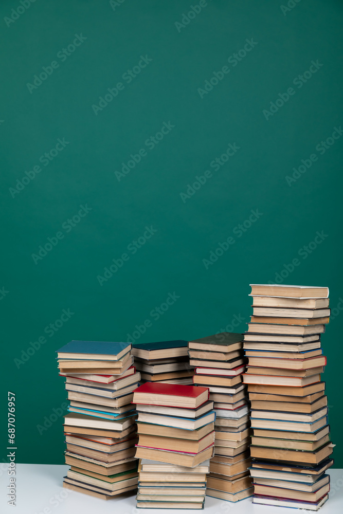 Stacks of Educational Books College University Library Green Background Stacks of Educational Books College University Library Green Background