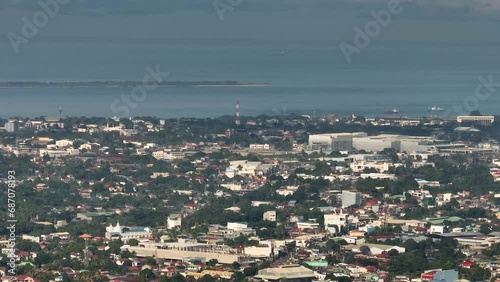 Coastline with modern buildings and towers. Zamboanga City, Philippines. photo