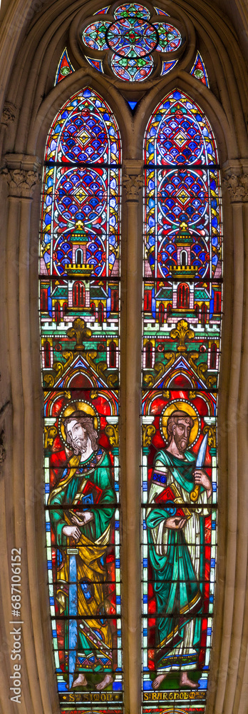 Stained glass windows in church religious scenes 