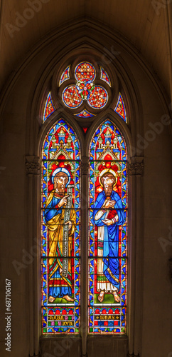 Biblical scenes on stained glass windows church 