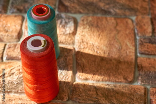 Wallpaper Mural Tailoring supplies, two spools of thread. Red, blue Torontodigital.ca