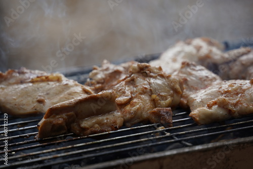 Fresh chicken steak grill meat on fire. Making barbecue on the grill