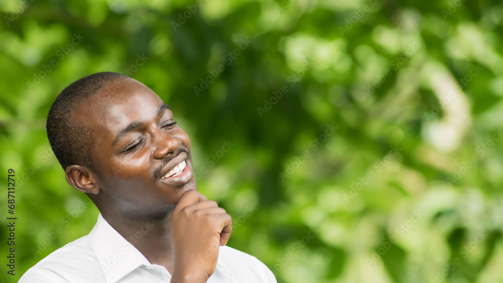 African businessman in white shirt thinking about workplace business problems.Black man sits and thinks for inspiration to find a solution to problems in life African businessman in white shirt thinking about workplace business problems.Black man sits and thinks for inspiration to find a solution to problems in life