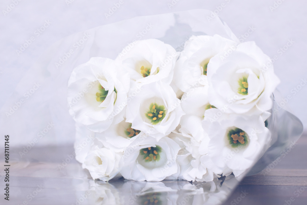 A bouquet of white roses. Flowers in a vase on the table. Wedding A bouquet of white roses. Flowers in a vase on the table. Wedding