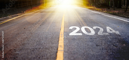 Obraz na płótnie new year 2024 a road leading forward. the idea of a new beginning business, strategy start up, and the journey into the future. w salonie