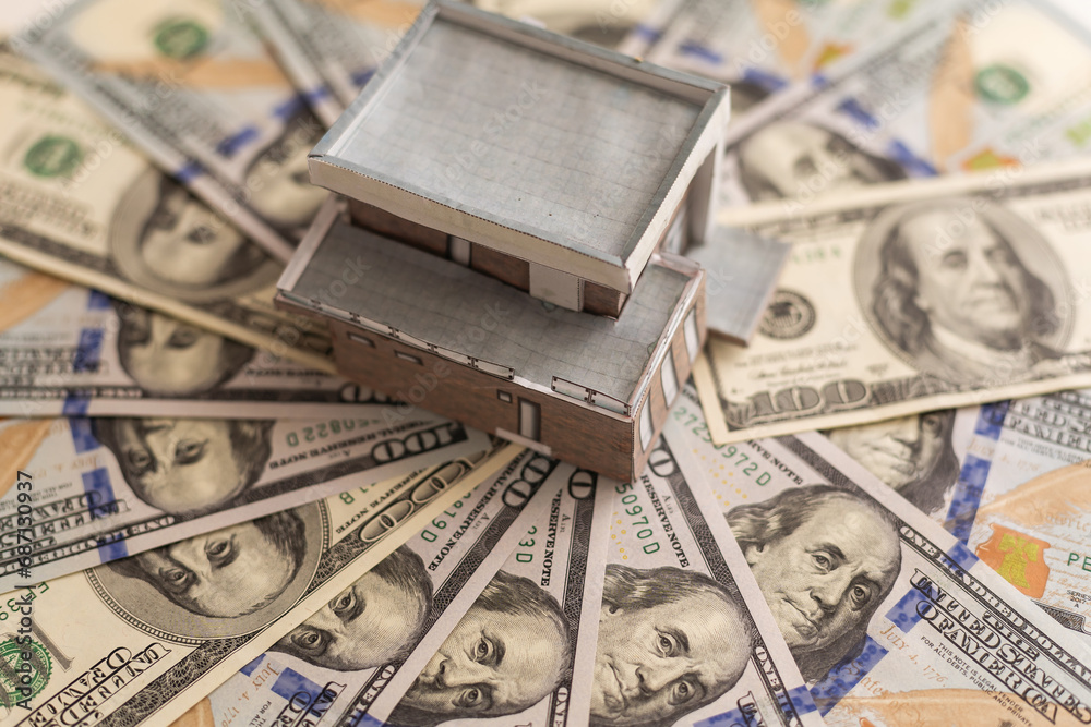 Banknotes with House on a white background. Real estate business concept. Banknotes with House on a white background. Real estate business concept.