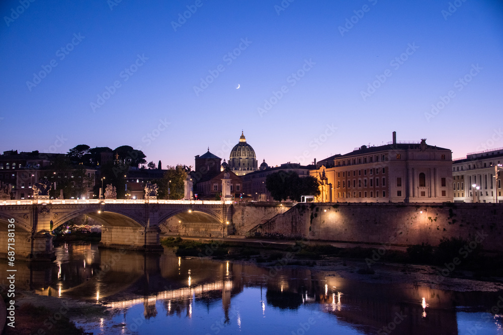 Magic view of Rome in the blue hour, with Saint Peter's Basilica in the background