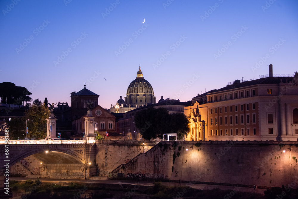 Magic view of Rome in the blue hour, with Saint Peter's Basilica in the background