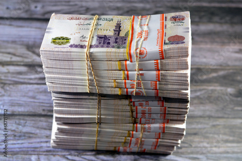 Piles and Stacks of Egypt money thousands of Pounds currency banknotes bills of 200 EGP LE, Egyptian money exchange rate and economy status, money concept, inflation crisis, currency and investment