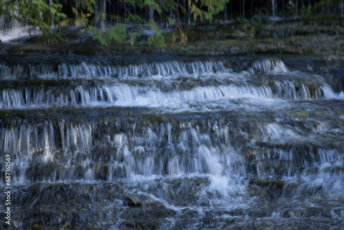 Waterfall over natural rocks