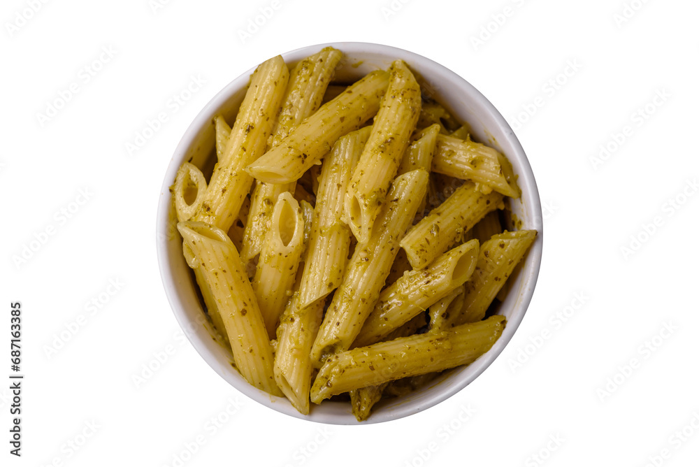 Delicious fresh pasta penne with green pesto sauce with basil, salt and spices Delicious fresh pasta penne with green pesto sauce with basil, salt and spices