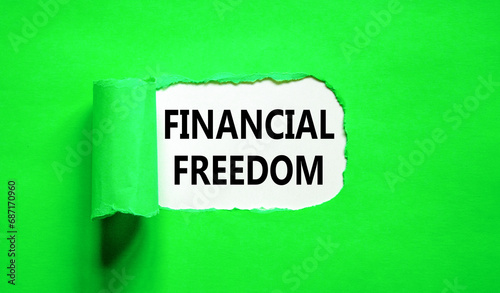 Financial freedom symbol. Concept words Financial freedom on beautiful white paper. Beautiful green paper background. Business financial freedom concept. Copy space.