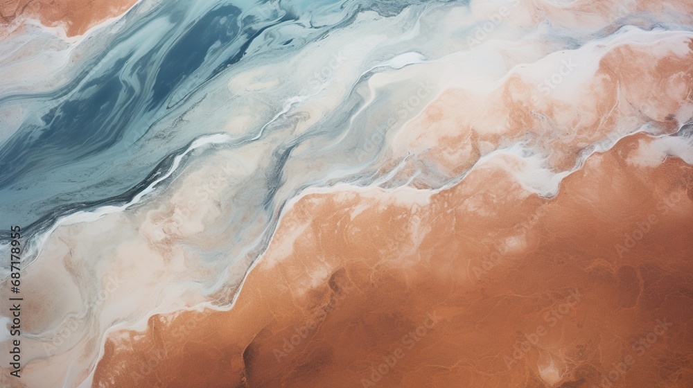 An abstract aerial view of a coastal landscape, with waves forming intricate patterns on the shoreline.