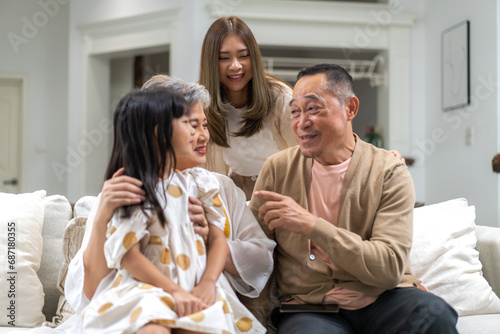 Portrait of happy love family asian mother playing with adorable asian kid girl.daughter, care, insurance.Happy family moments good time love with grandparents.Love of big family