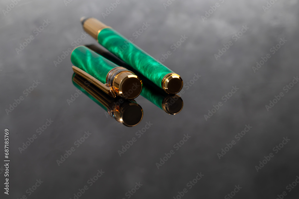 Fountain pen on marble and gray background. Gift concept. Fountain pen on marble and gray background. Gift concept.