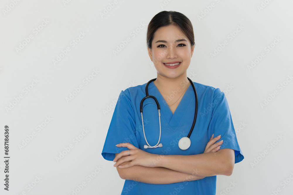 Portrait of a young attractive doctor standing and having her arms crossed. Portrait of a young attractive doctor standing and having her arms crossed.