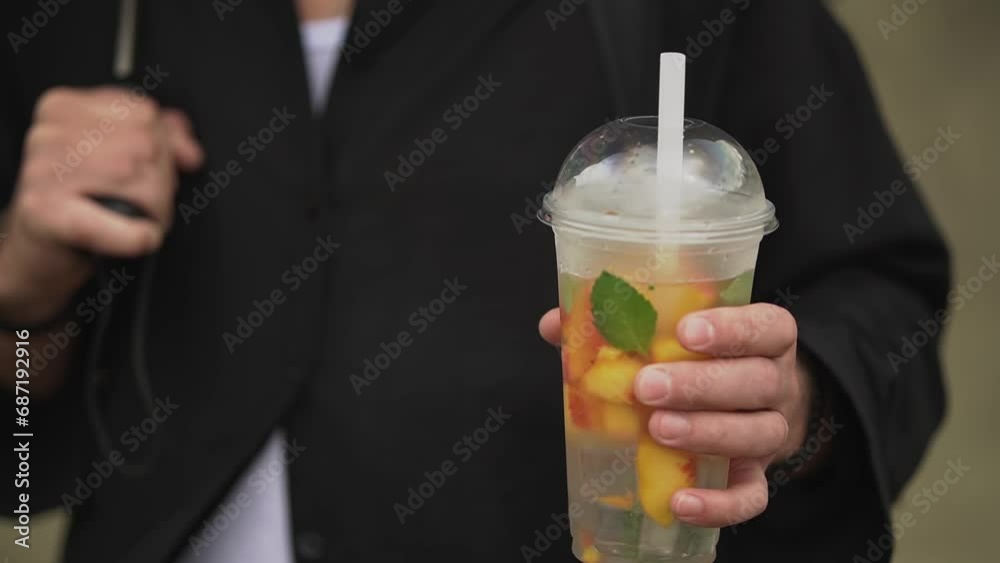 man in the desert. man and cocktail. refreshing fruit cocktail. High quality 4K footage man in the desert. man and cocktail. refreshing fruit cocktail. High quality 4K footage