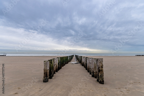 wooden groyne on the beach in Vlissingen, Zeeland, Netherlands © Björn Wylezich