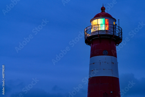 short lighthouse of Westkapelle, Netherlands at dusk photo