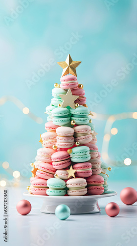 Decorative Christmas tree with sweet macaroons on blue background. Sweet macaroons arranged in a Christmas tree with a star on the top. Vertical.