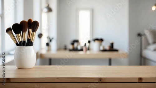empty wooden table top with blur background of makeup room photo