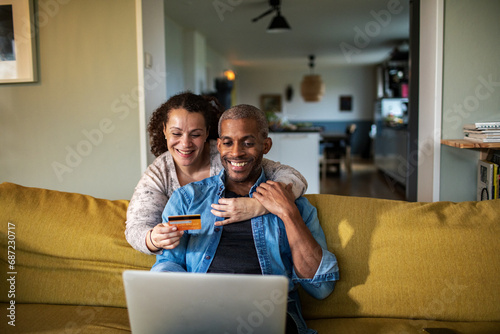 Couple shopping online together at home