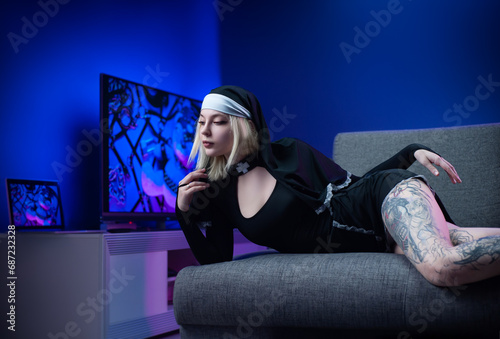 A sexy girl in a sexy revealing nun dress excitingly flirts in beautiful lighting on a neon background