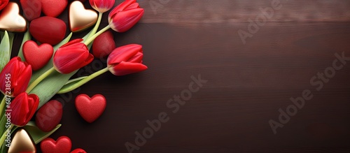 Valentine s Day themed with chocolates hearts and red tulips Copy space image Place for adding text or design photo