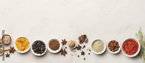 Traditional Chinese herbal medicine in white porcelain bowls on a marble background viewed from above Copy space image Place for adding text or design