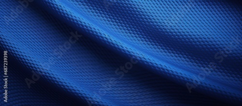 Texture of football jersey fabric in blue with stitched details Copy space image Place for adding text or design photo