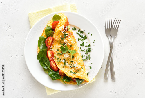 Stuffed omelette with tomatoes and spinach
