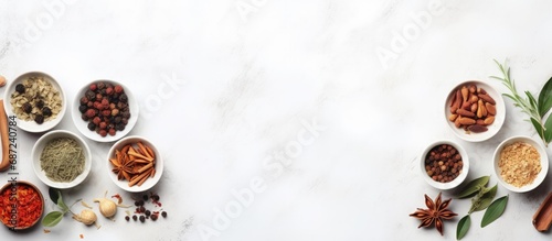 Traditional Chinese herbal medicine in white porcelain bowls on a marble background viewed from above Copy space image Place for adding text or design photo