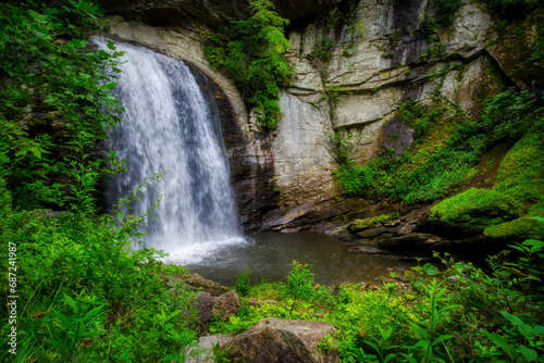 A beautiful waterfall landscape of Looking Glass Falls in the forest of the Blue Ridge Mountains in North Carolina.
