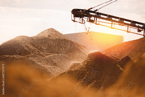 Photos Sand quarry, Industrial plant with belt conveyor in open pit mining with sun light