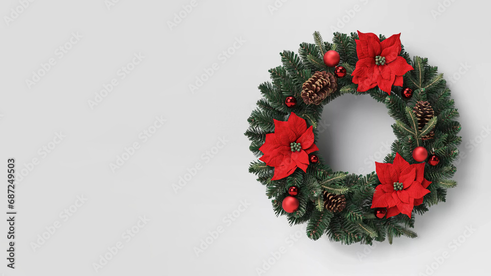 Christmas wreath with pines and poinsettia flowers on copy-space background.