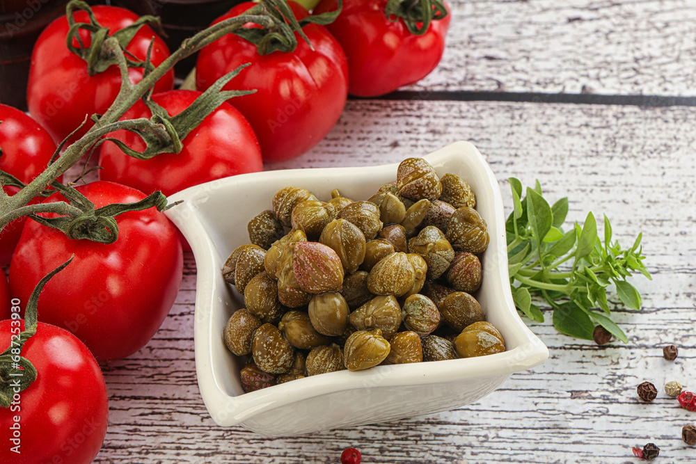 Marinated green capers in the bowl Marinated green capers in the bowl