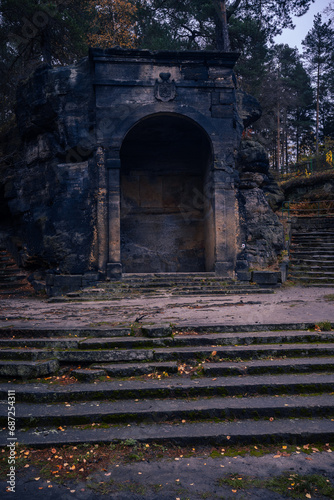 Old stone monument from old ages hidden deep in the dark woods of north Bohemia. © Tadeas