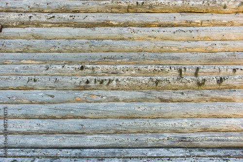 background of wooden logs wall of old rural house