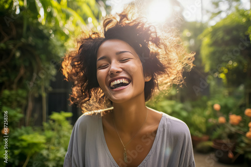 A woman in blissful laughter, her hair illuminated by sunlight, surrounded by a lush garden, epitomizes joyful serenity.
