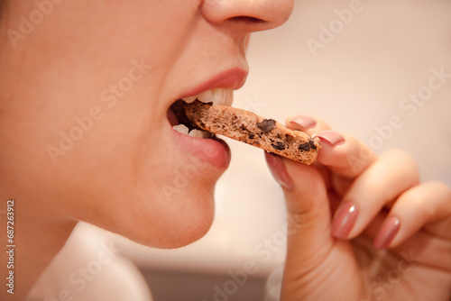 eating disorder due to problems and stress. woman eats up problems with sweets. © cenchild