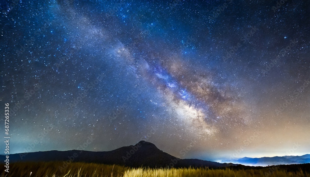 milky way galaxy with stars and space dust in the universe long exposure photograph with grain