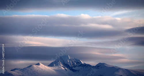 Winter alpine landscape in National Park Retezat, Carpathians, Romania, Europe. Snow covered moutains scenery photo