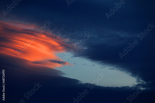 Lenticular clouds in sunset light photo
