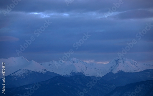 Winter alpine landscape in National Park Retezat  Carpathians  Romania  Europe. Snow covered moutains scenery