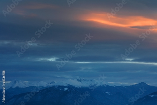 Lenticular clouds in sunset light photo